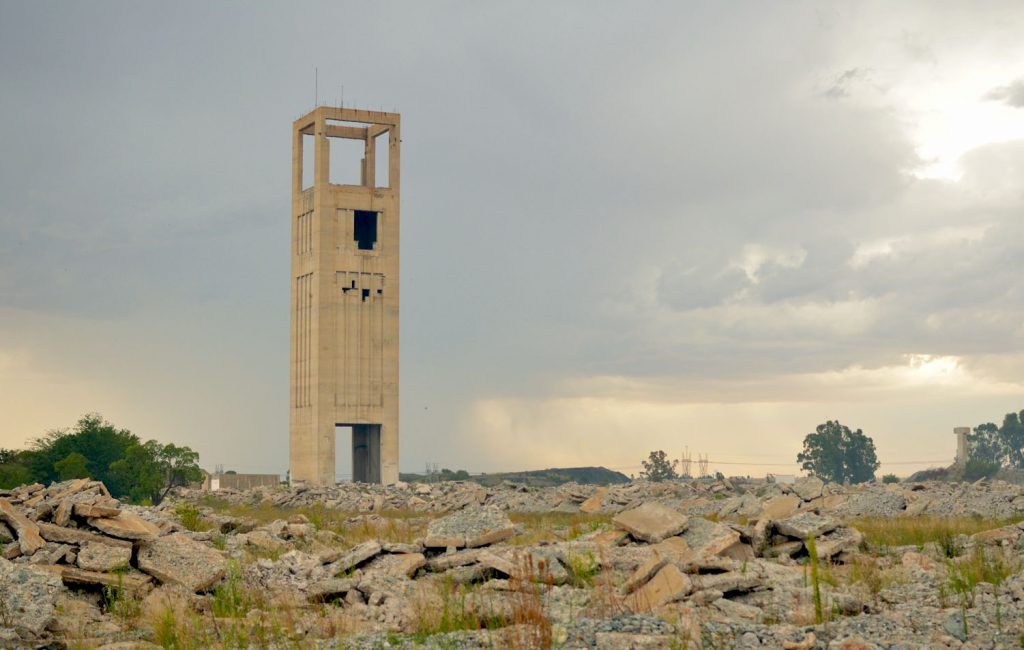 A mine shaft rises from the ruins of a former gold mine outside Welkom. Documents indicate that more than R5-billion is held in mine rehabilitation funds in Free State, and the operations with the largest 5% of the funds account for 99% of that money