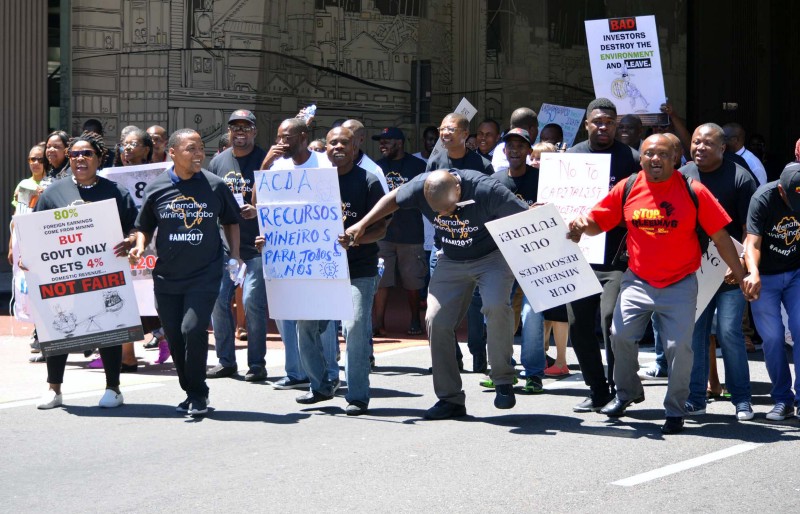 Delegates from the Alternative Mining Indaba protest outside the industry’s Mining Indaba in Cape Town. Photo: Mark Olalde